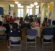 An audience gathered in the hall for a talk