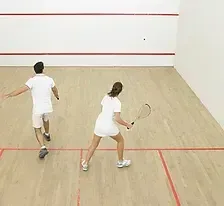 Two players on a squash court