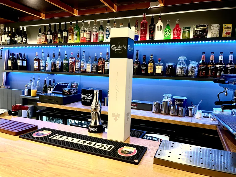 Drinks and glassware on display behind the Café & Bar @GXCA